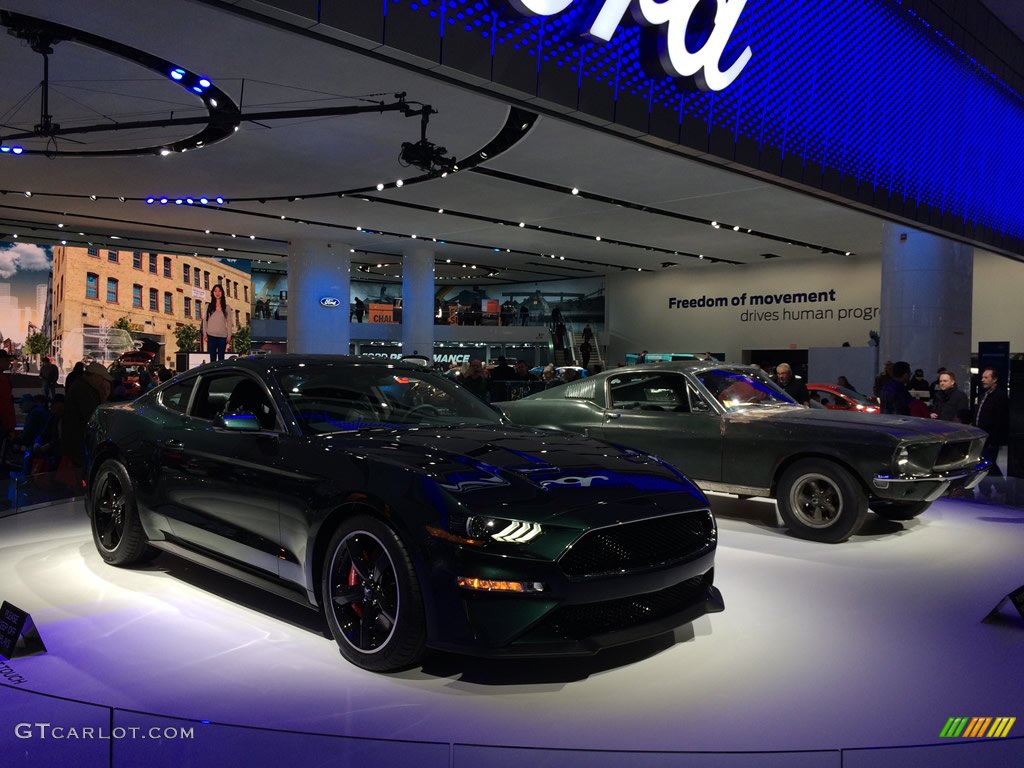 2018 Ford Mustang Bullitt nect to a 1968 Mustang GT Fastback
