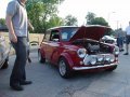 Morris Mini being scrutinized by giant