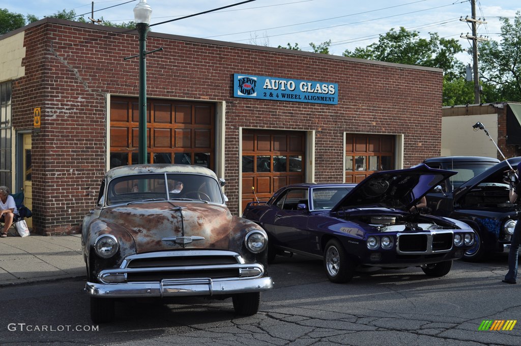 Chevy Beater Sedan and a Pontiac Firebird