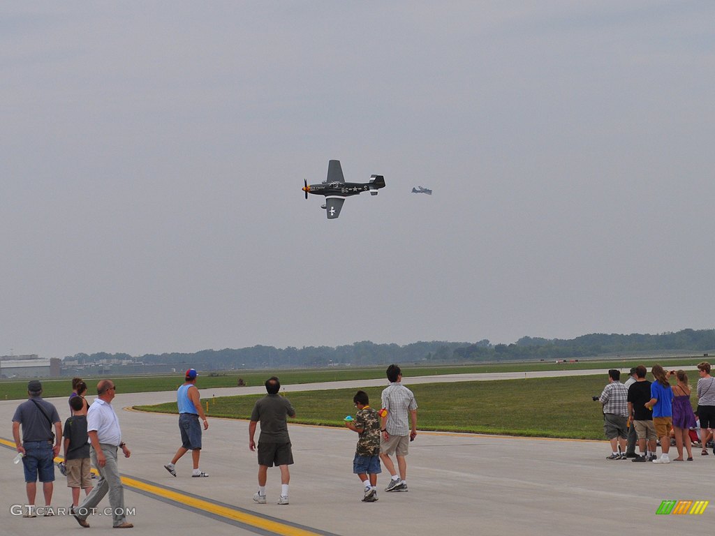 P-51 Mustang and a B-17 Flying Fortress in the distance