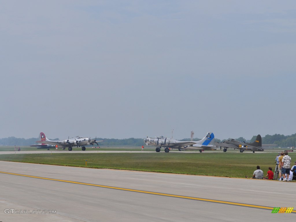 B-17's on the taxiway, from left “ Aluminum Overcast”  “ Sentimental Journey ” and “ Memphis Belle ”