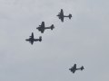 A Consolidated B-24 Liberator Leading 3 Boeing B-17 Flying Fortress's