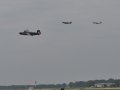 Consolidated B-24J Liberator, escorted by two North American Aviation P-51 Mustangs