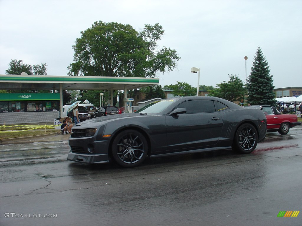 A dark looking 2010 Chevrolet Camaro.