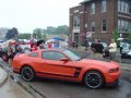 2012 Ford Mustang Boss 302 in Competition Orange at the Woodward Dream Cruise Ford Display
