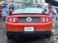 Mustang Boss 302 in Competition Orange, view of the back.