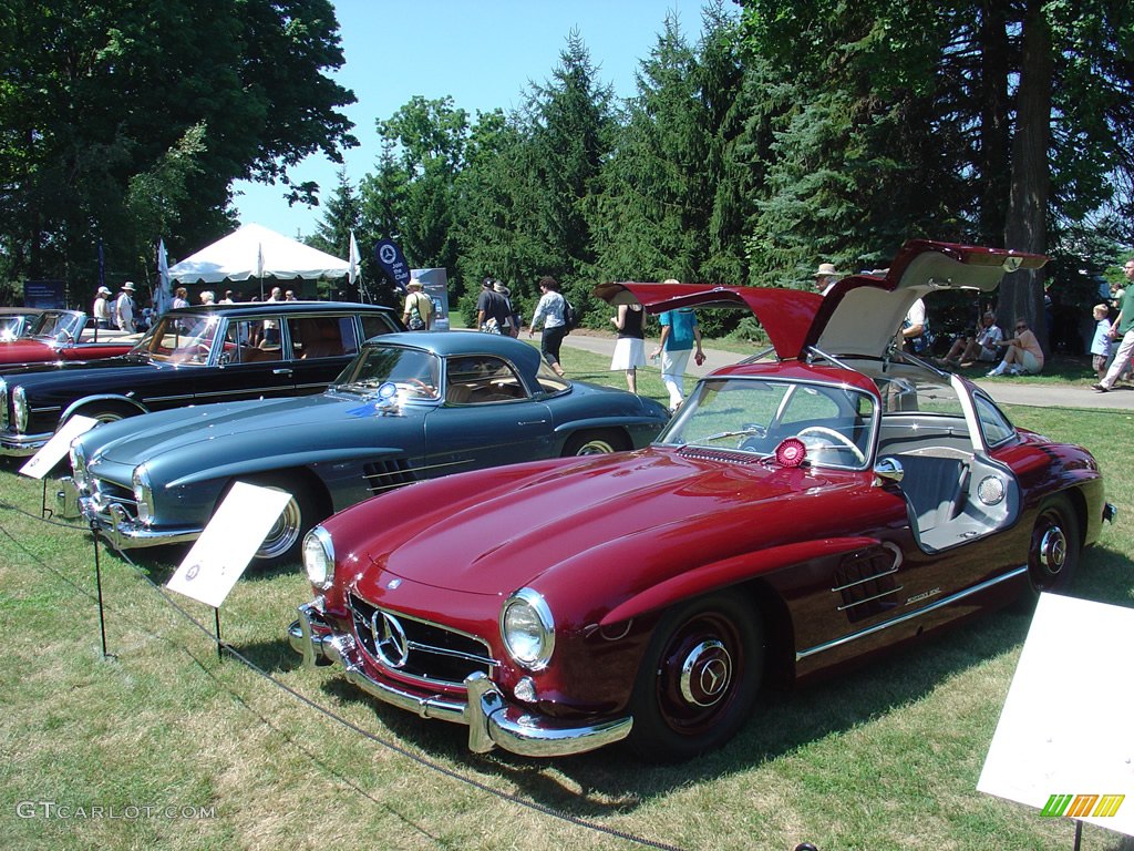 1954 Mercedes-Benz 300 SL Gullwing next to a 1960 Mercedes-Benz 300 SL Coupe